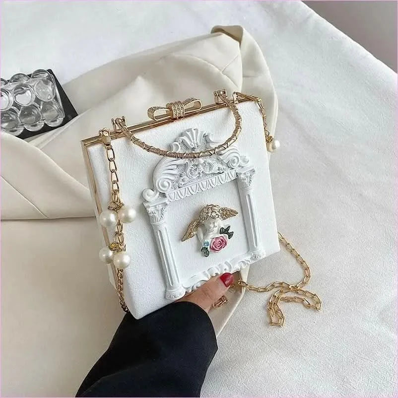 Ornate Black Shoulder Chain Bag with Cherub Detail - Pleasures and Sins